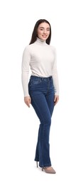 Photo of Young woman in stylish jeans on white background
