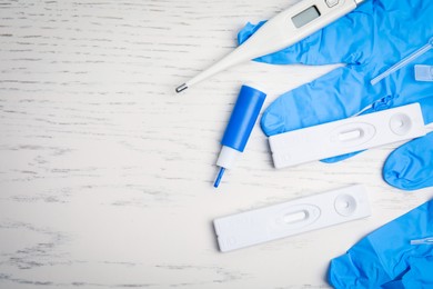 Photo of Disposable express hepatitis test kit on white wooden table, flat lay. Space for text