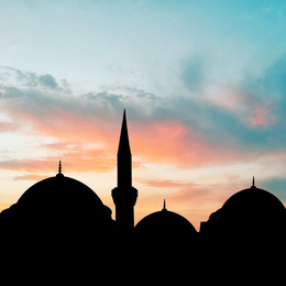 Image of Silhouette of mosque during sunset. Muslim culture