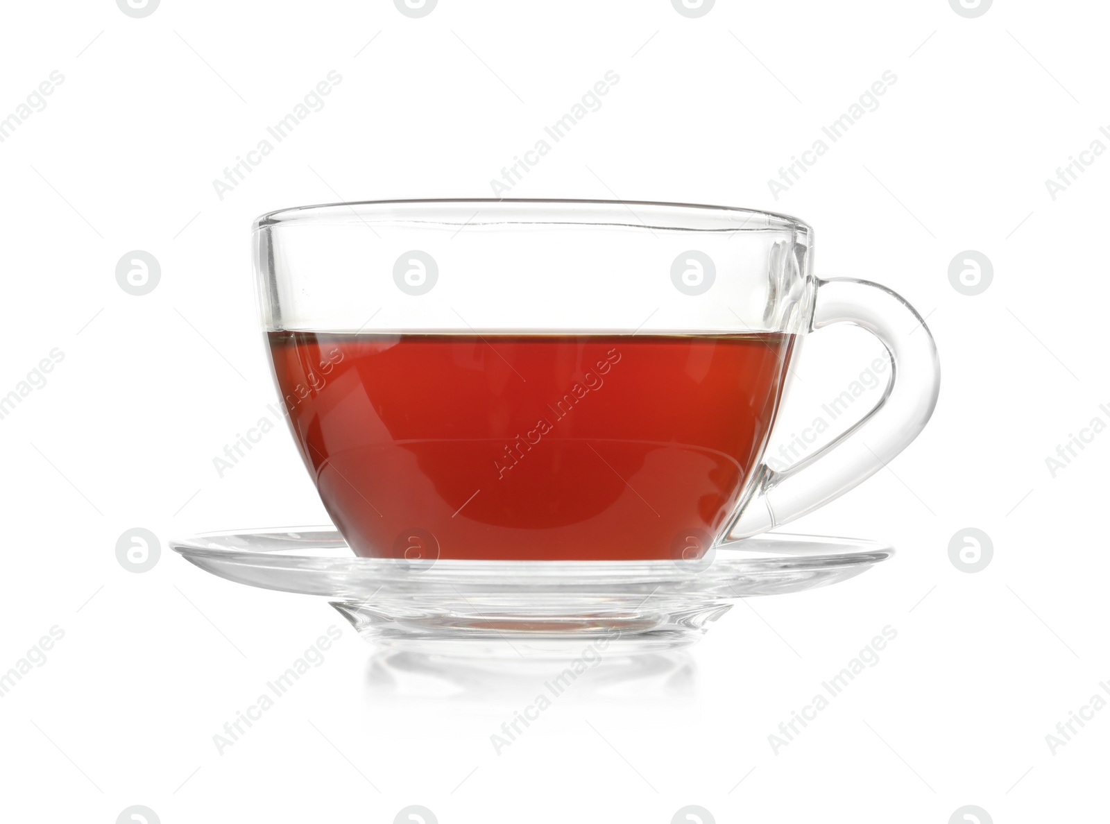 Photo of Glass cup of tea and saucer on white background