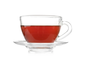 Photo of Glass cup of tea and saucer on white background