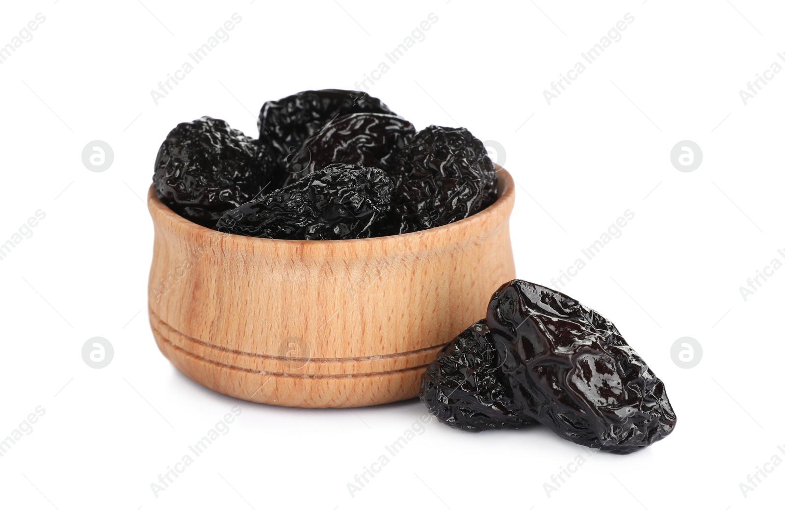 Photo of Wooden bowl and sweet dried prunes on white background