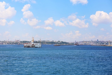 Photo of ISTANBUL, TURKEY - AUGUST 07, 2018: Ship in sea with city on background