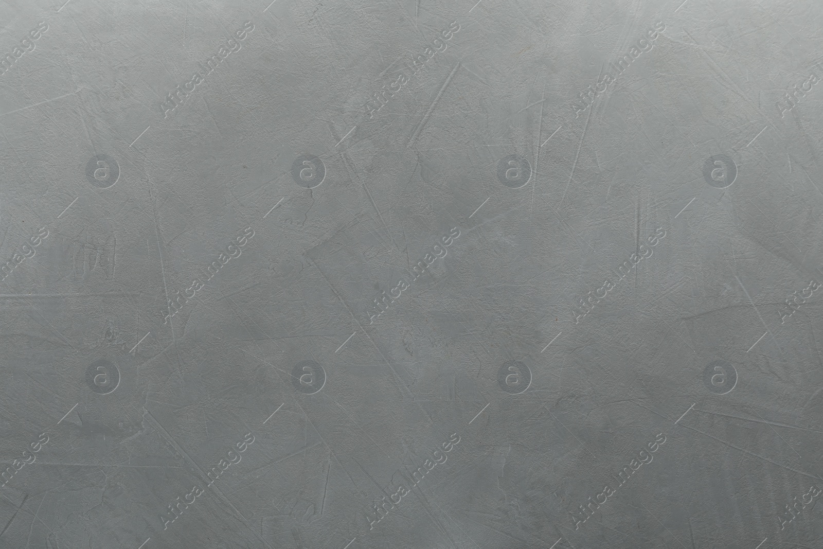 Photo of Light gray textured surface as background, top view