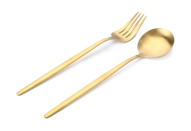 Photo of Shiny golden fork and spoon isolated on white. Luxury cutlery