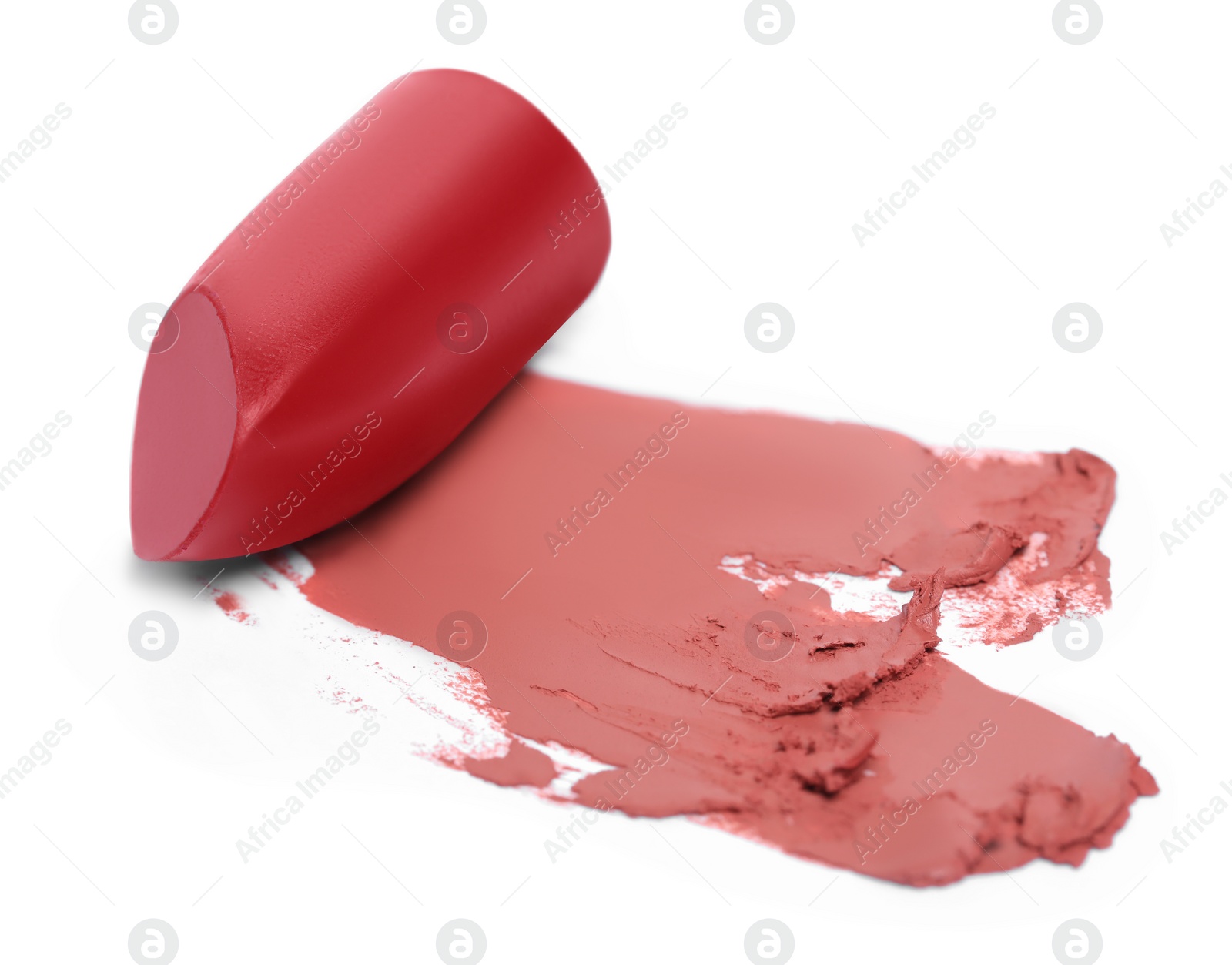 Photo of Red lipstick and smears on white background