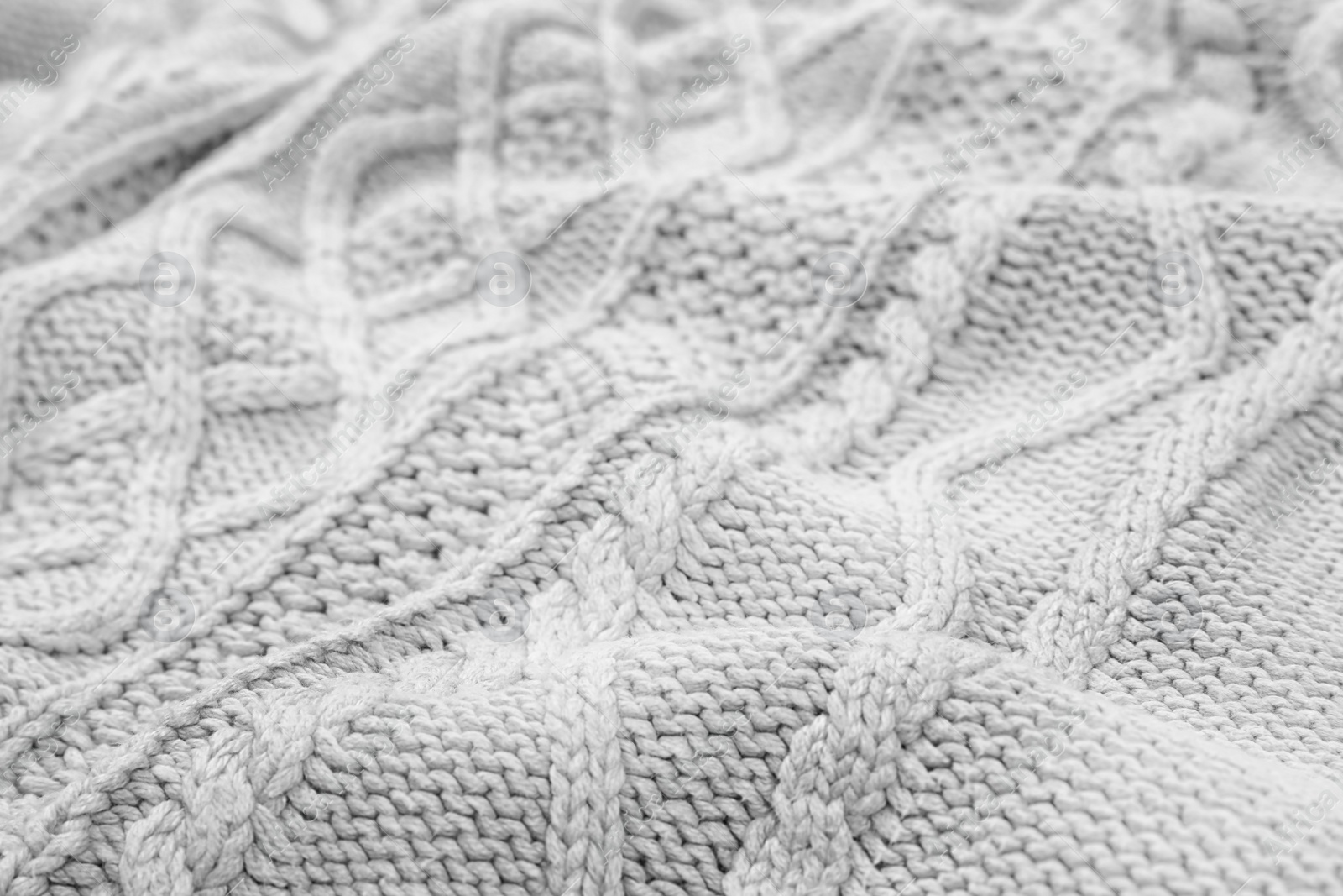 Photo of Texture of cozy warm sweater as background, closeup