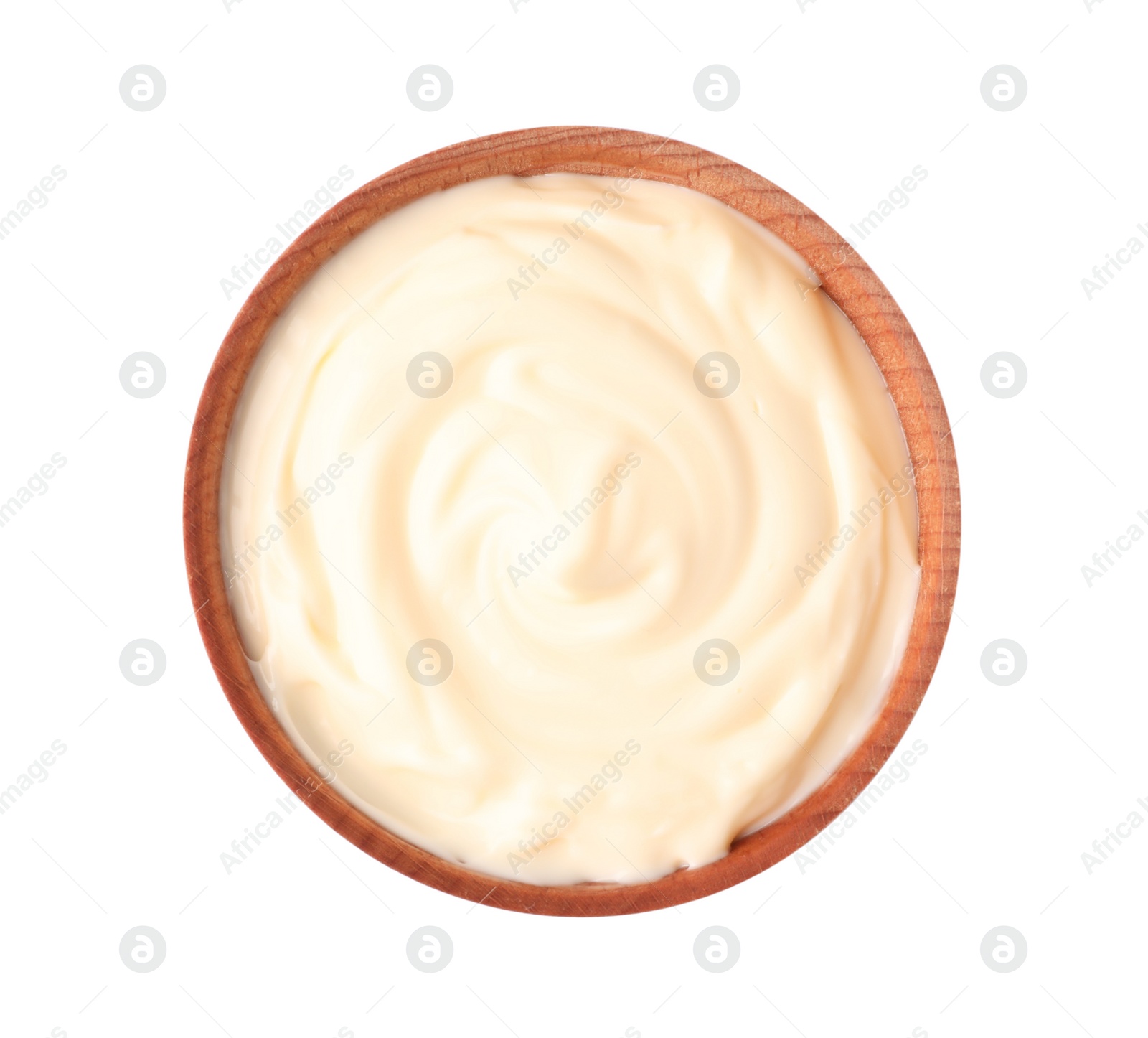 Photo of Tasty mayonnaise in wooden bowl isolated on white, top view