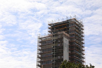 View of construction site with unfinished building against sky