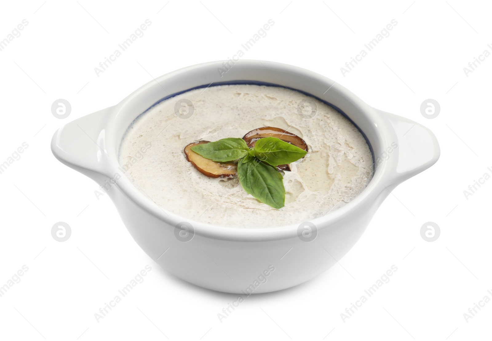 Photo of Fresh homemade mushroom soup in ceramic pot isolated on white