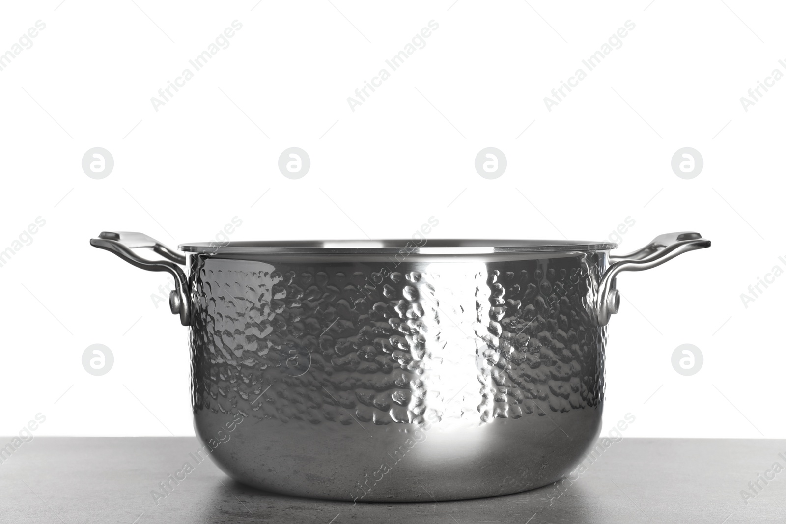 Photo of New clean saucepan on table against white background