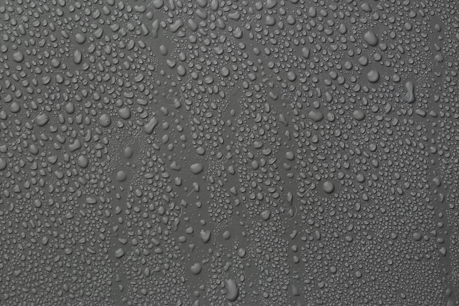 Photo of View of many water drops on grey background