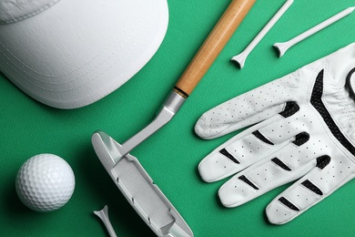 Set of golf equipment on color background, flat lay