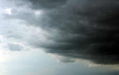 Photo of Sky with heavy rainy clouds on grey day