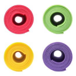 Image of Set with colorful rolled camping mats on white background 