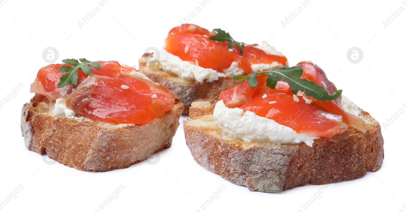 Photo of Delicious sandwiches with cream cheese, salmon and arugula on white background