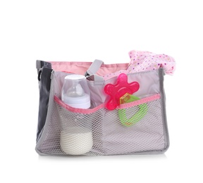 Maternity bag with baby accessories on white background