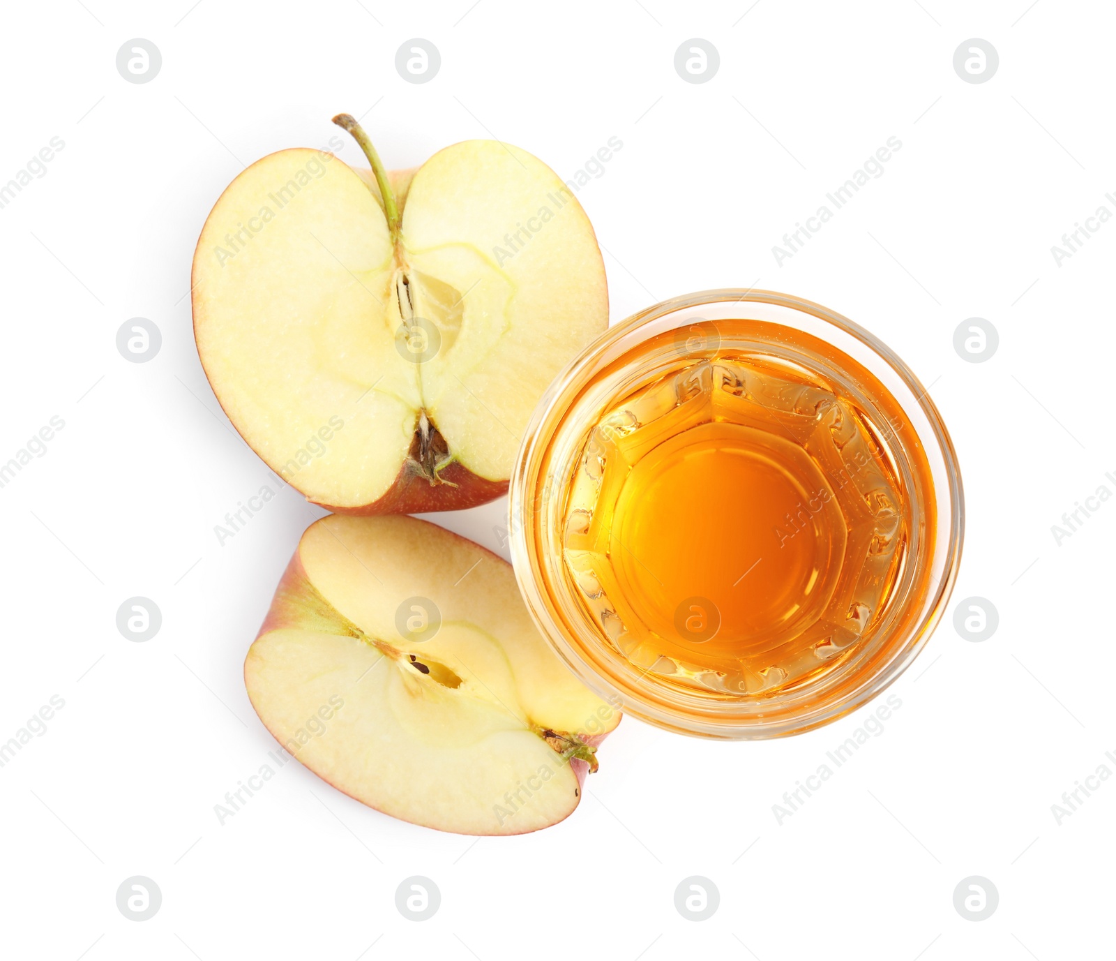 Photo of Glass with delicious cider and pieces of ripe apple on white background, top view