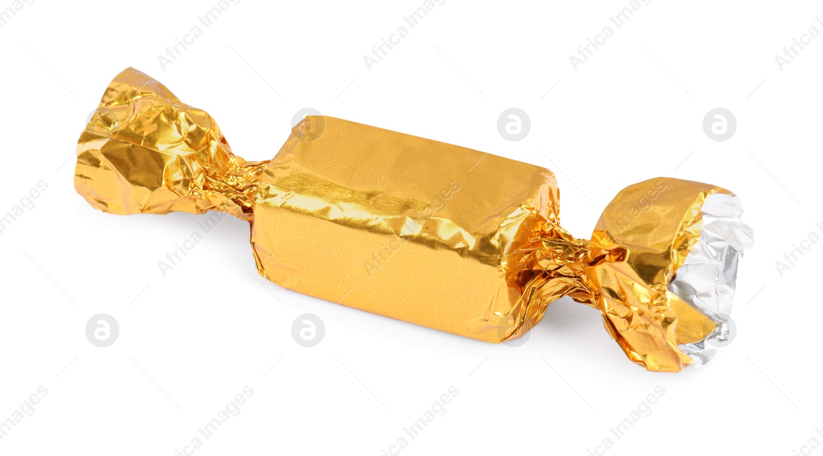 Photo of Tasty candy in golden wrapper isolated on white