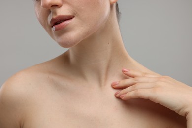 Beauty concept. Woman on grey background, closeup