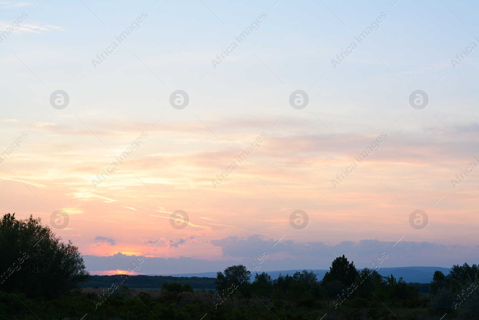 Photo of Picturesque view of beautiful countryside at sunset