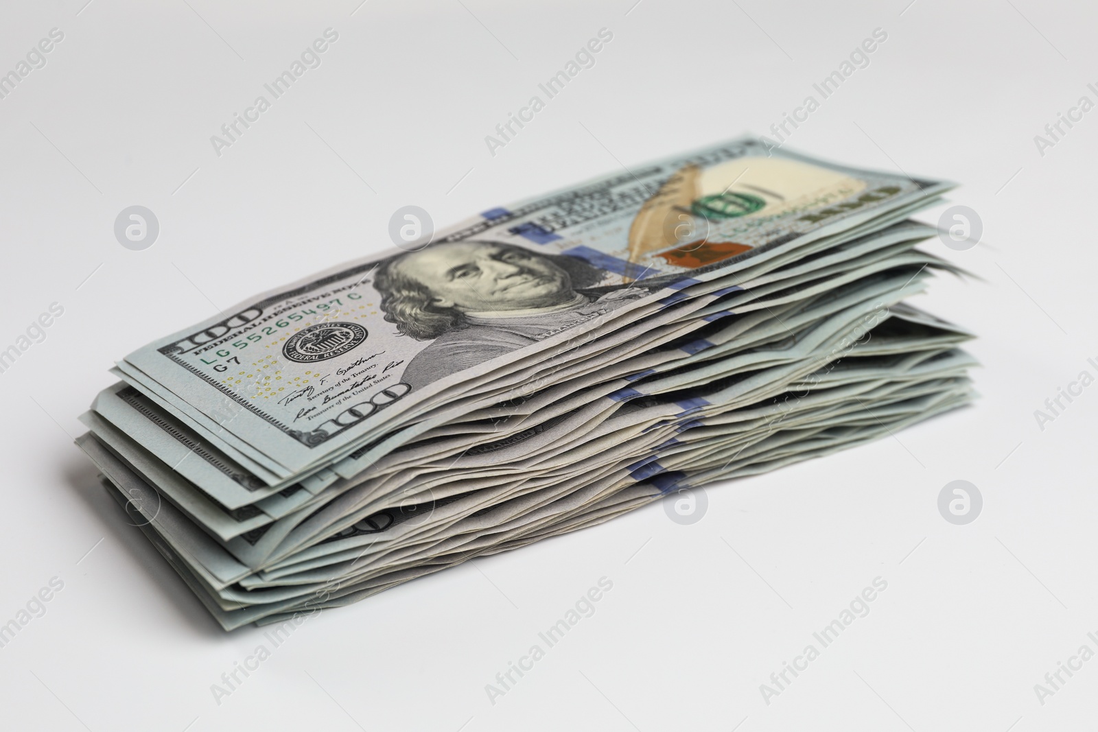Photo of Money exchange. Dollar banknotes on white background, closeup