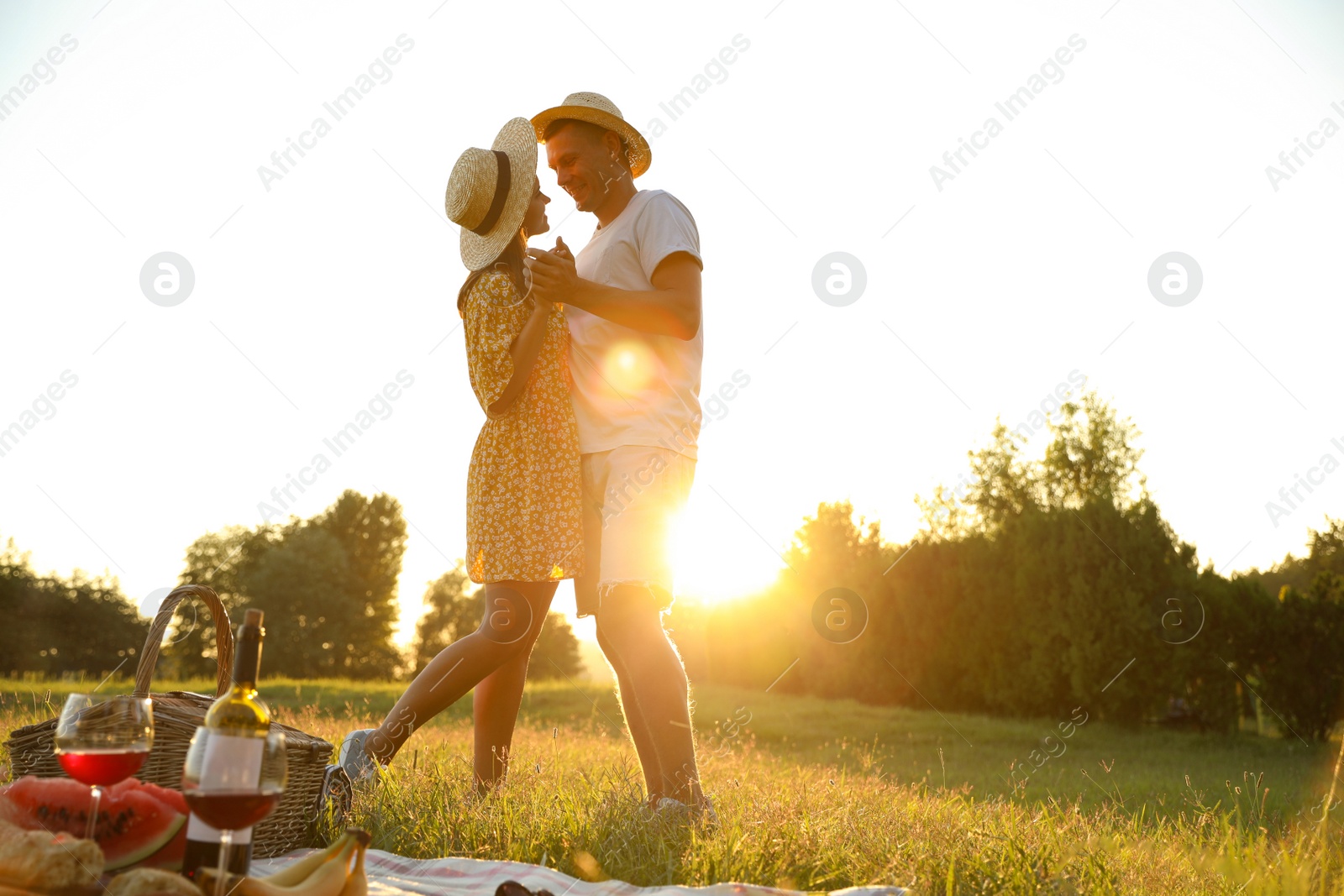 Photo of Happy couple dancing on picnic in park
