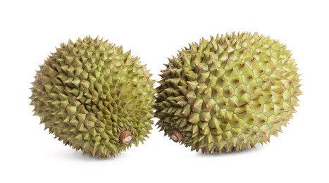 Photo of Whole ripe durian fruits on white background