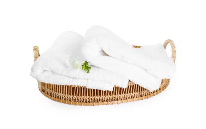 Photo of Terry towels and freesia flower in basket isolated on white