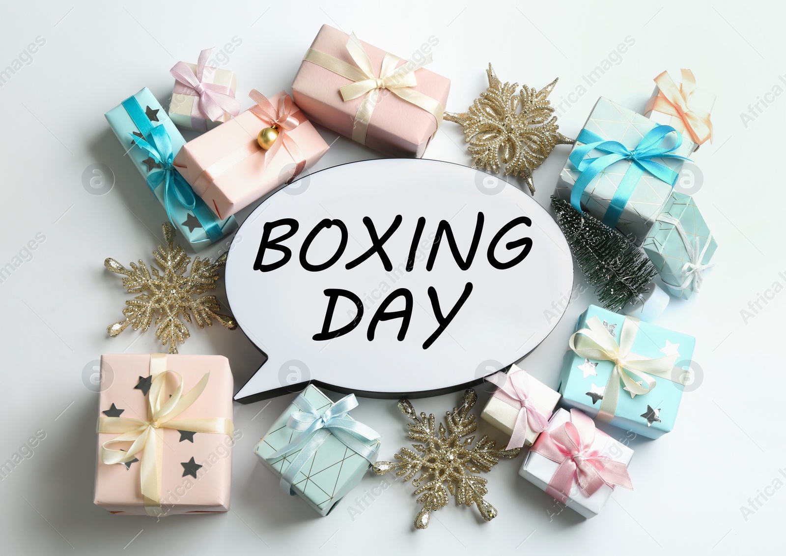 Photo of Speech bubble with phrase BOXING DAY and Christmas decorations on white background, flat lay