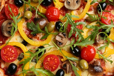 Photo of Delicious vegetable pizza as background, top view