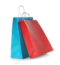 Photo of Mockup of paper shopping bags on white background