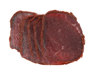 Photo of Delicious dry-cured beef basturma slices on white background, top view