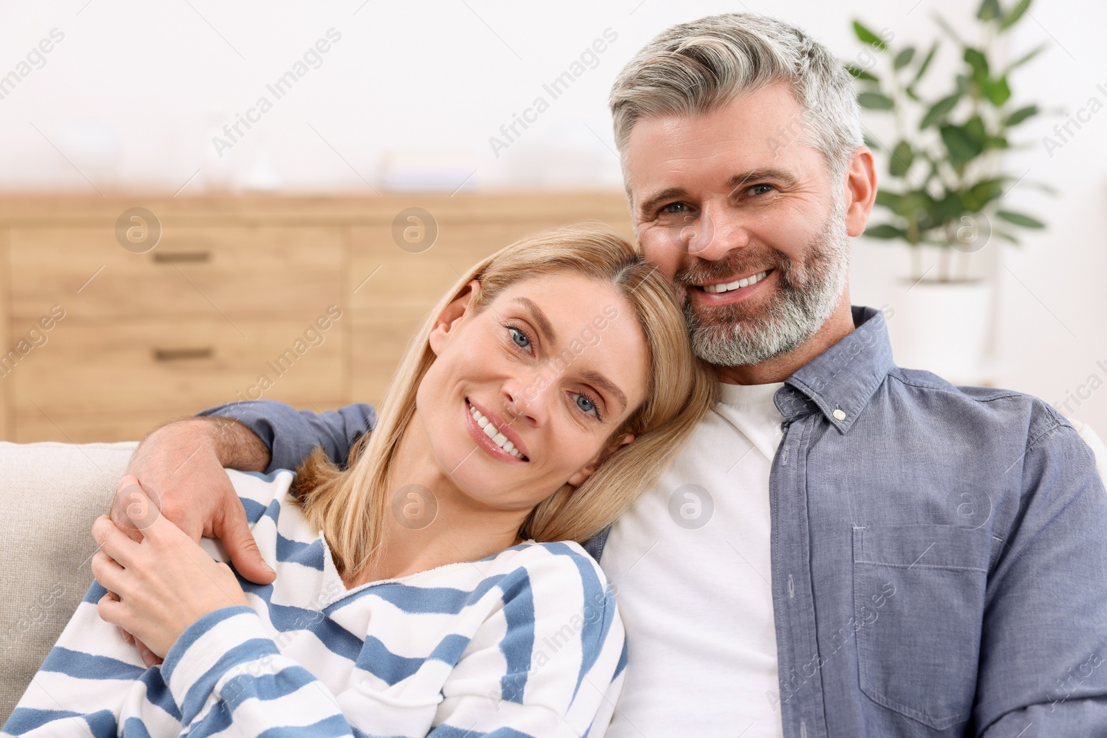 Photo of Portrait of happy affectionate couple at home. Romantic date