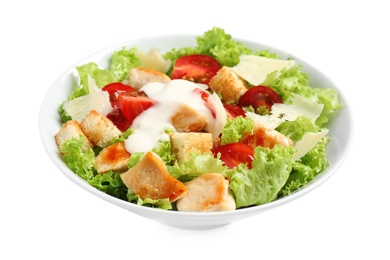 Delicious fresh Caesar salad in bowl on white background 