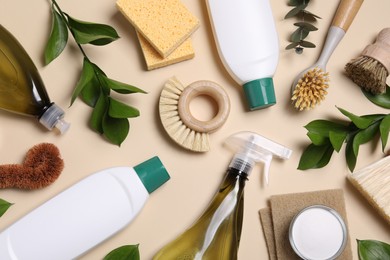 Flat lay composition with different cleaning supplies on beige background