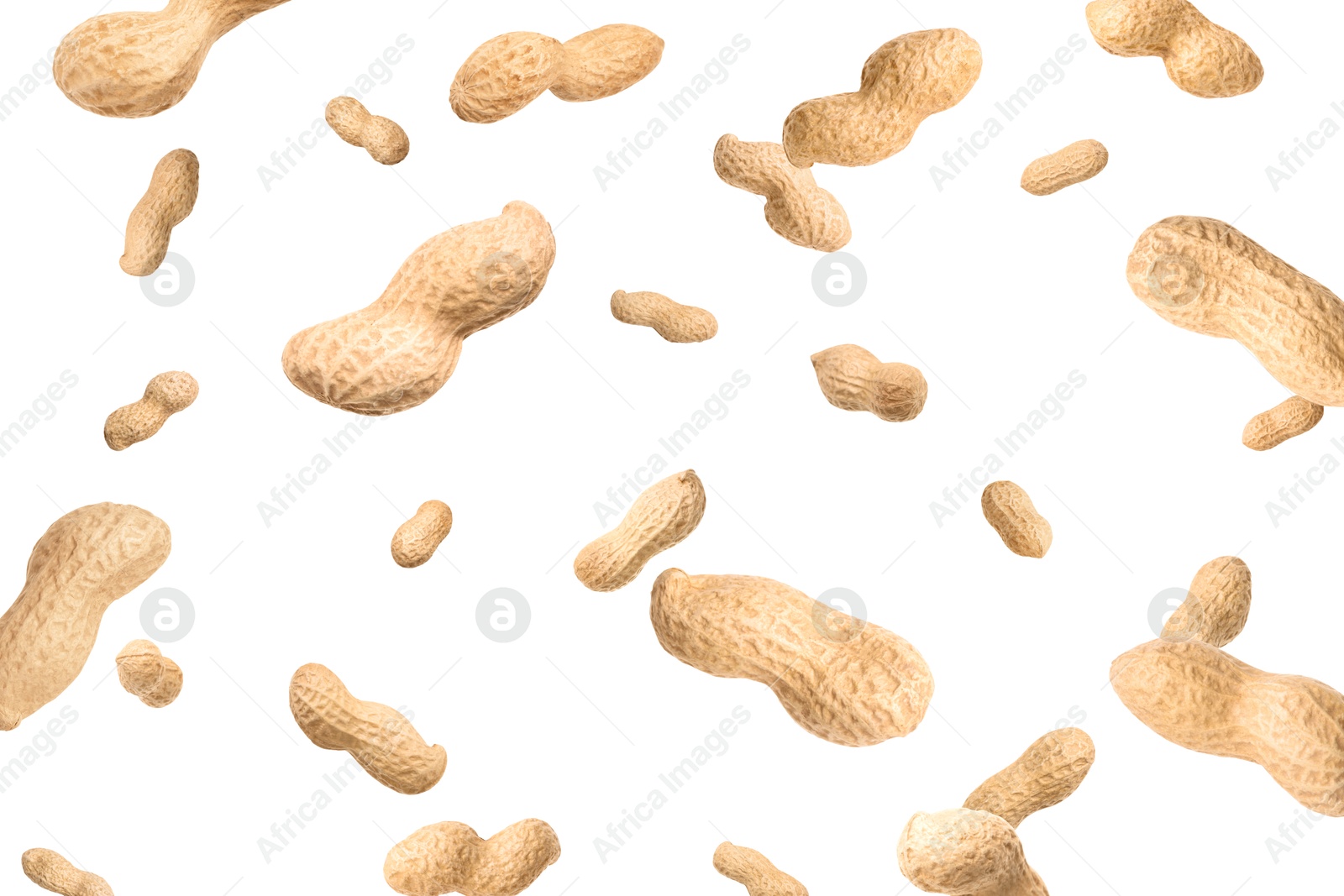 Image of Unpeeled peanuts in air on white background