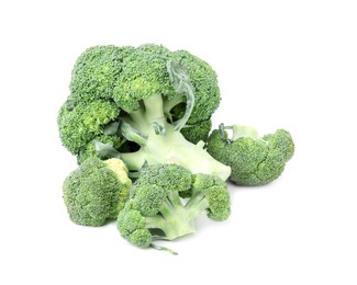 Photo of Pile of fresh raw green broccoli isolated on white