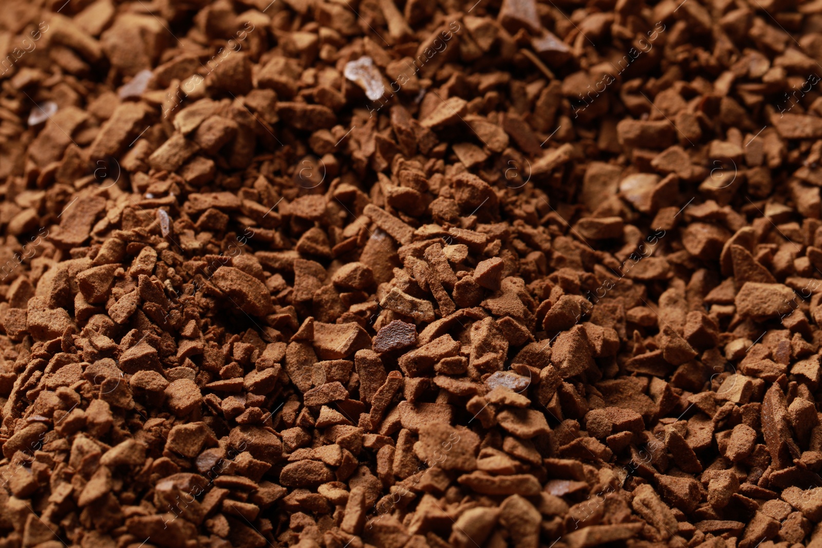 Photo of Dry instant coffee as background, closeup view