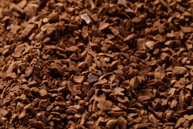 Photo of Dry instant coffee as background, closeup view