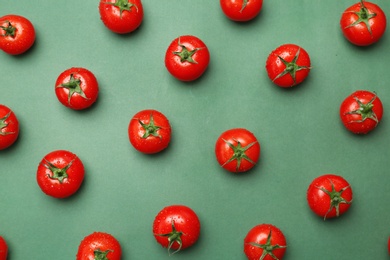 Photo of Flat lay composition with ripe tomatoes on color background