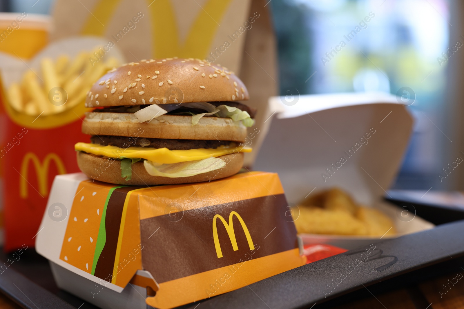 Photo of Lviv, Ukraine - October 9, 2023: Tasty McDonald's menu on table in restaurant, selective focus