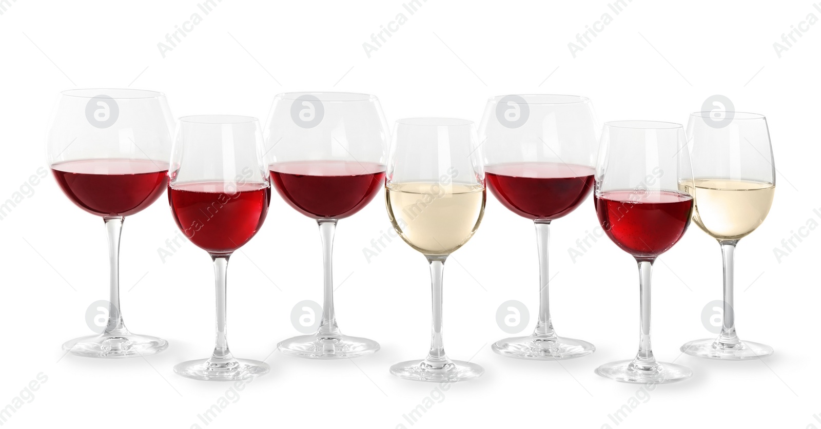 Photo of Glasses with different wine on light background