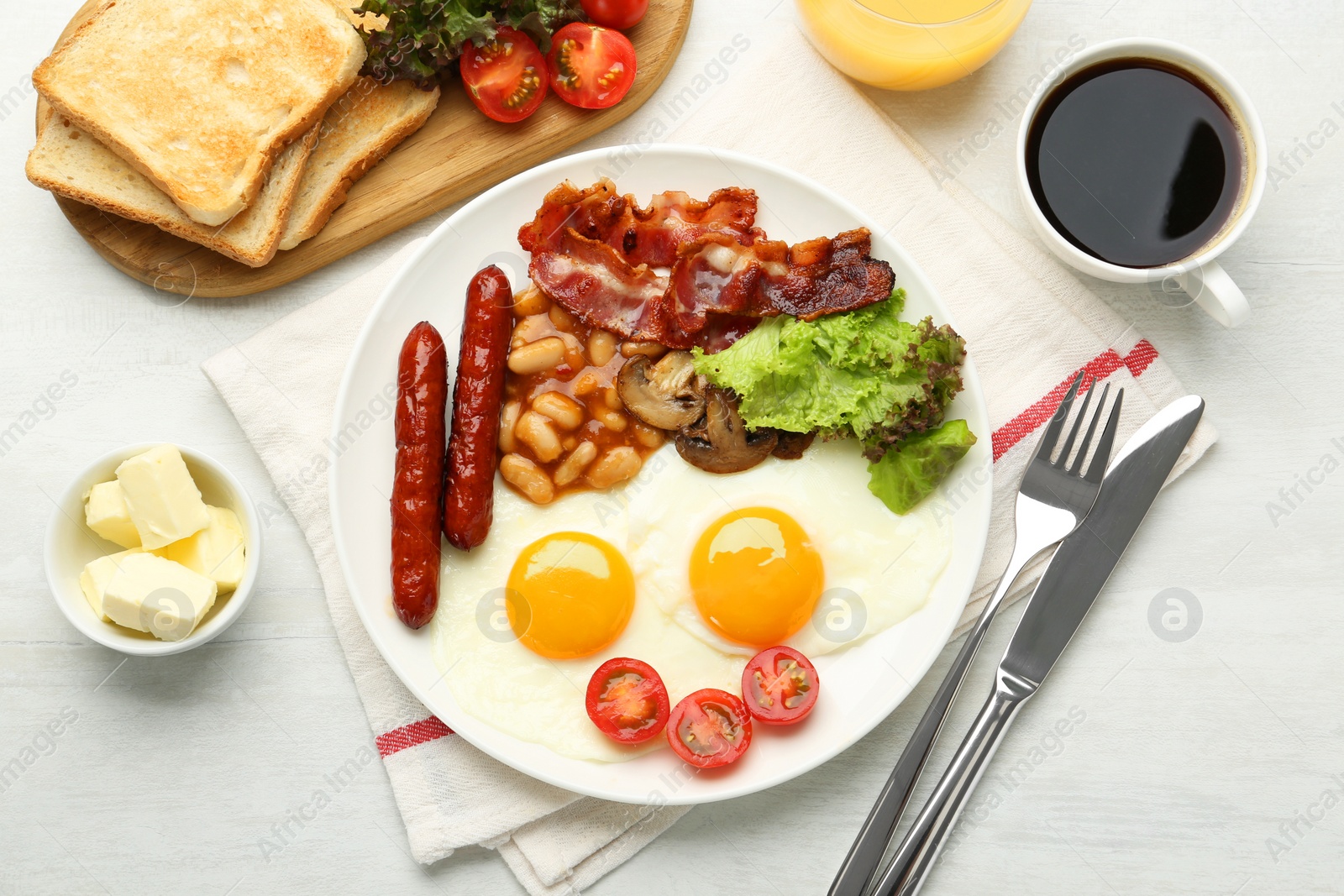 Photo of Delicious breakfast with sunny side up eggs served on white table, flat lay