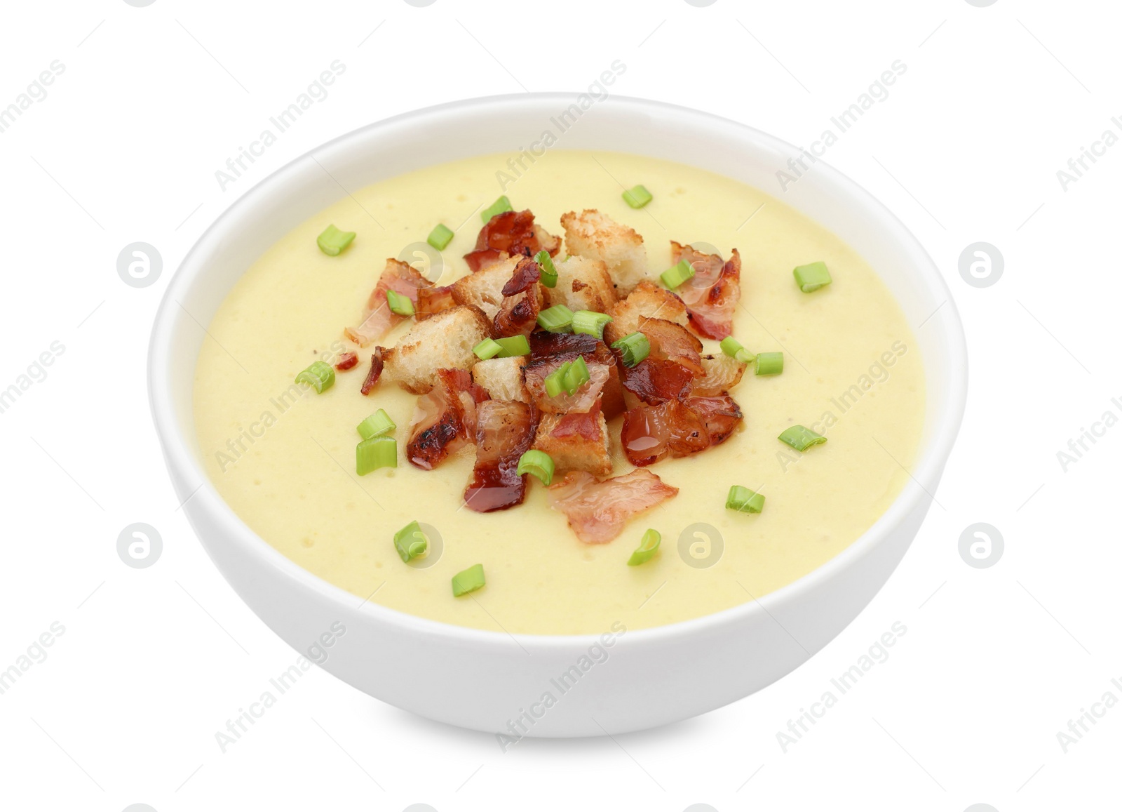 Photo of Tasty potato soup with bacon, croutons and green onion in bowl isolated on white