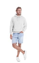 Photo of Full length portrait of man in hoodie sweater on white background. Space for design