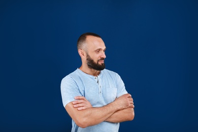 Portrait of handsome man on blue background