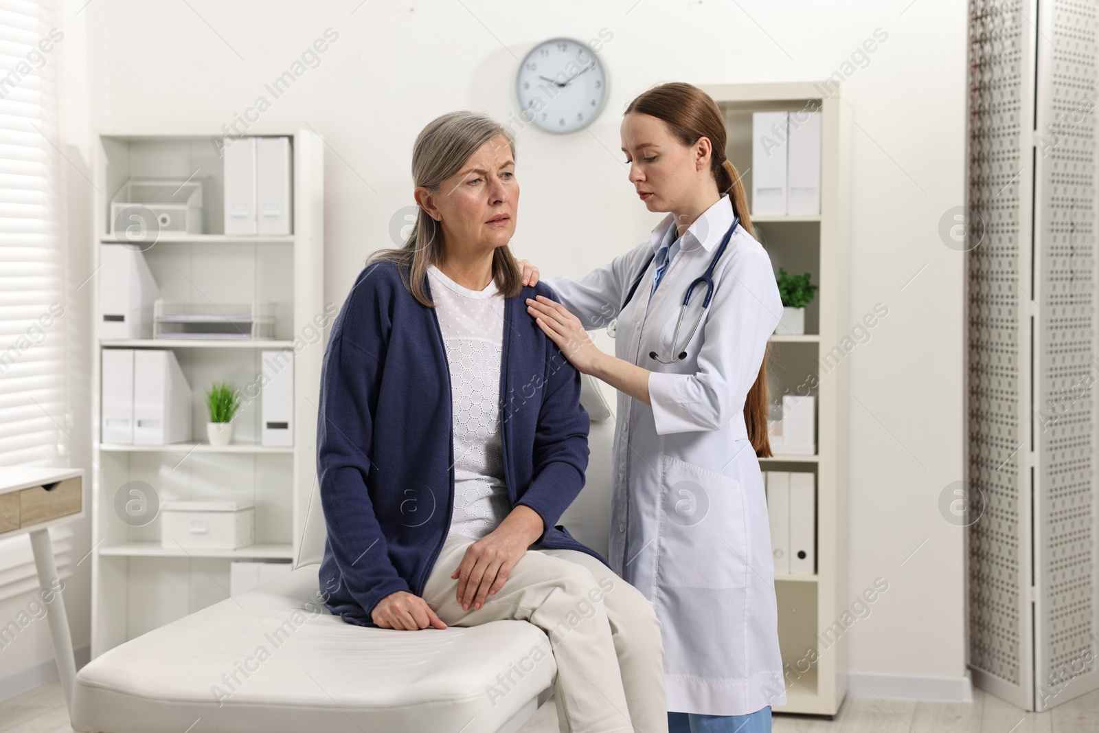 Photo of Arthritis symptoms. Doctor examining patient with shoulder pain in hospital