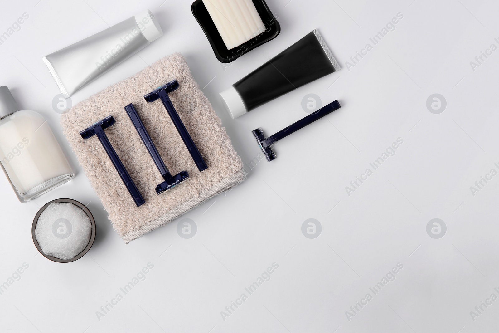 Photo of Different men's shaving accessories on white background, flat lay. Space for text
