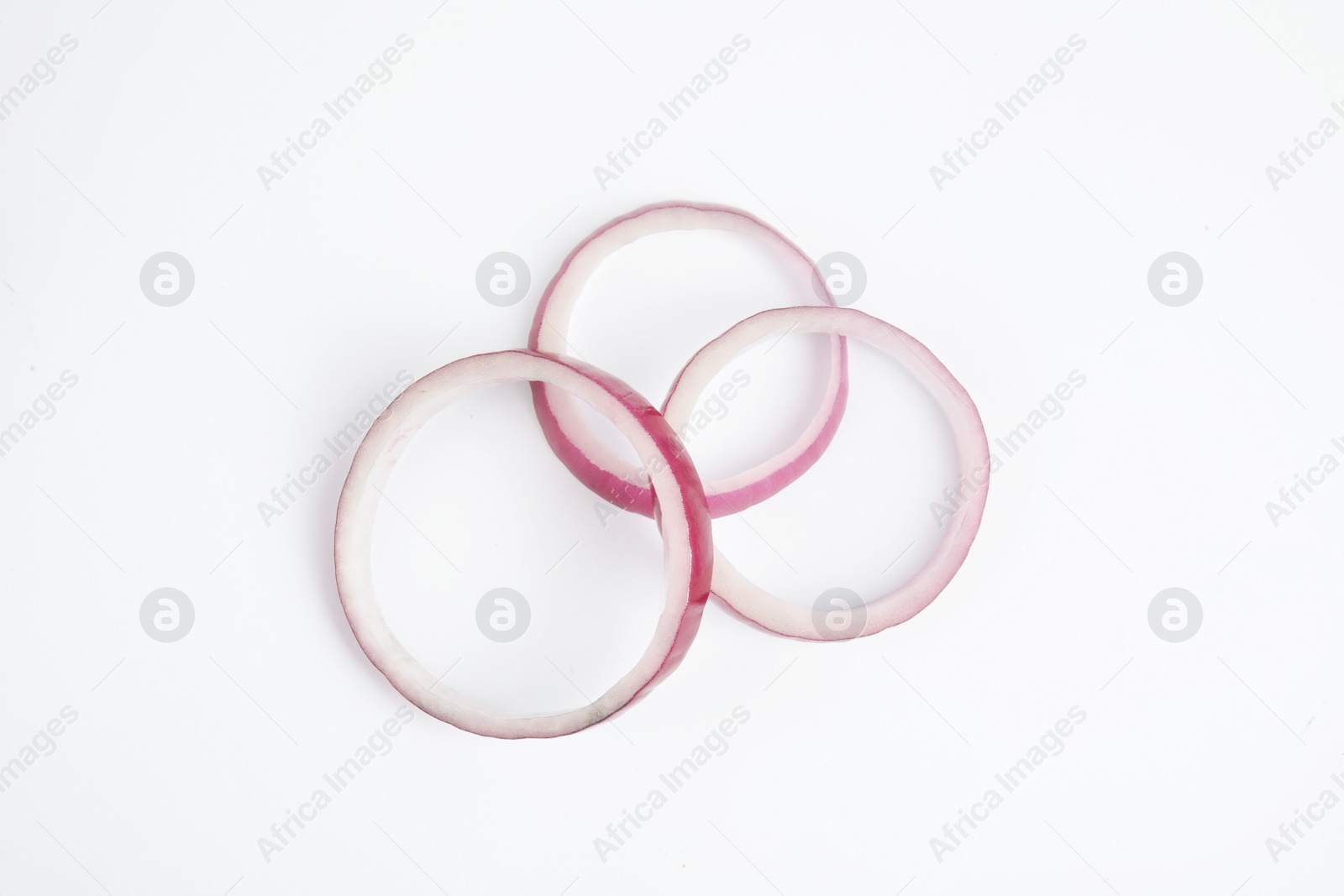 Photo of Fresh slices of red onion on white background